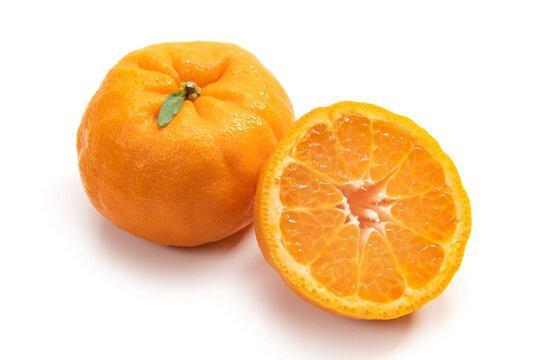 
                  
                    Whole and sliced mandarin on a white background
                  
                